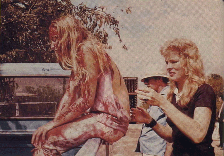 Dottie Pearl applying Kayro-syrup for blood on Marilyn Burns in preparation for the final scene.