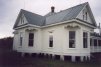 Front left corner of the house.  The chicken room is in front (on the right).