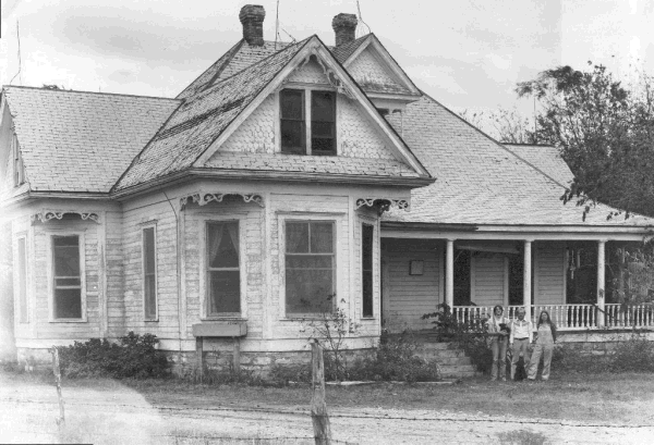 John Thomas (pictured middle) on Quick Hill living in the Leatherface home.